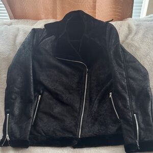 Faux Leather Jacket with Silver Zippers and comfy lining.